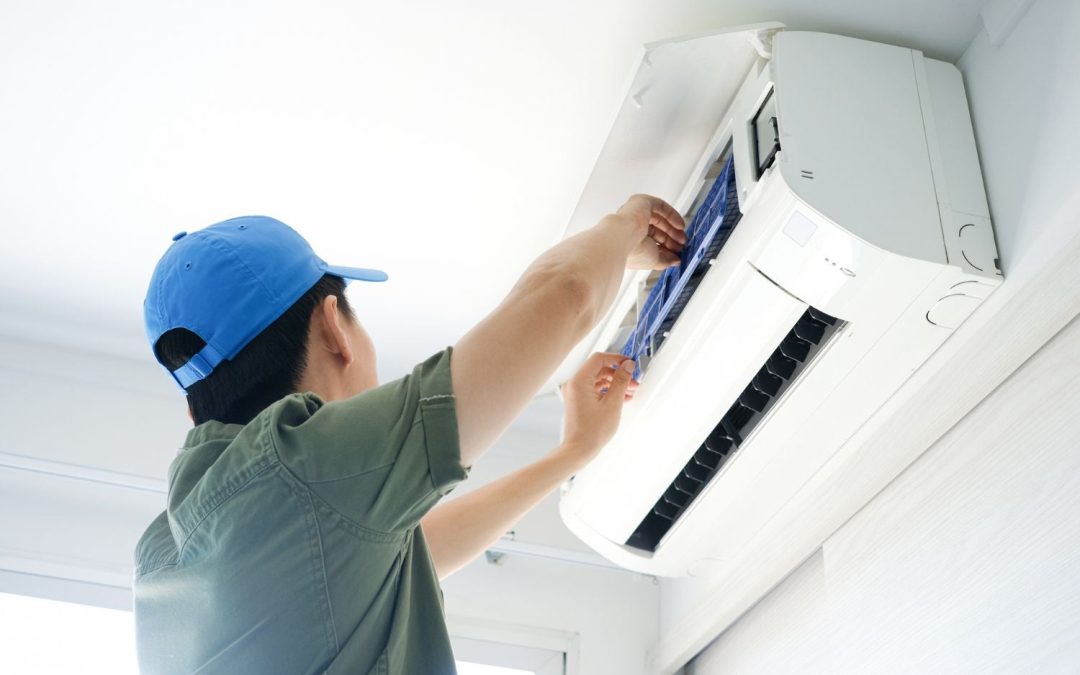 Air conditioning technician maintaining an indoor mini split system in Avondale, AZ